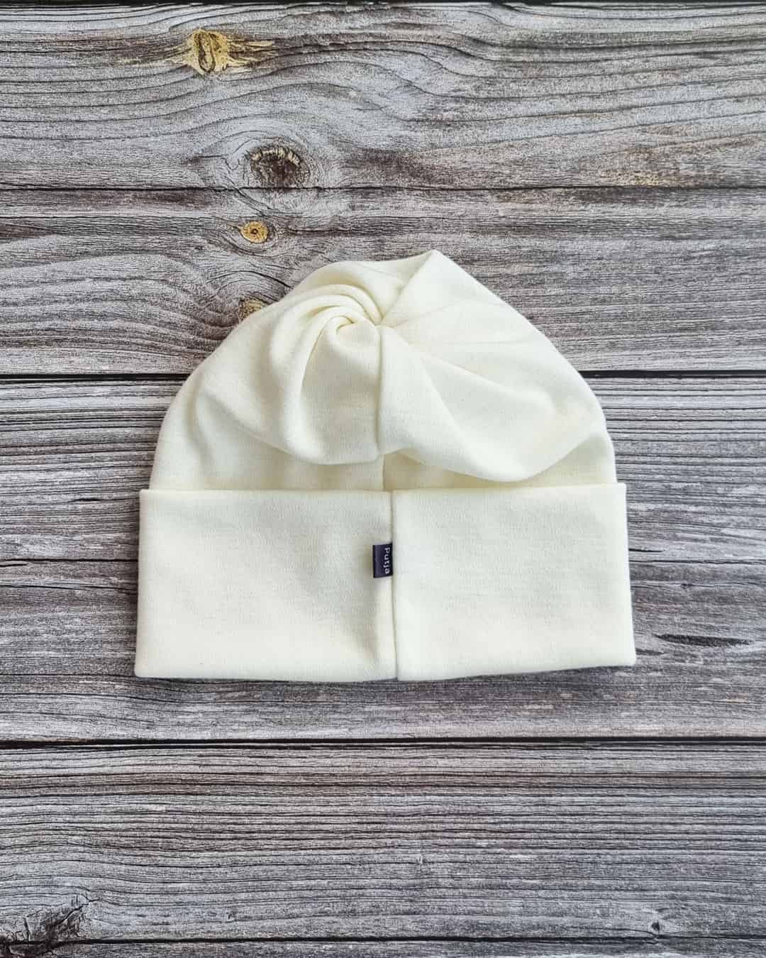 Lasten luonnon valkoinen merinovilla ponnaripipo.